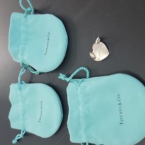 Tiffany & Co. Charm and 3 jewelry bags selling together